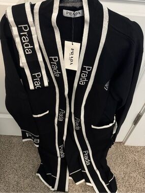 Prada Black Cardigan with White Trim and Logo Detailing. Comes with knitted belt